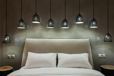 a bedroom with a white bed with lights above it at *** Apt 110m2 3bed 2bath, walk to Acropolis *** in Athens