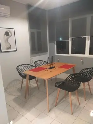 a dining room with a wooden table and chairs at Athenian Luxury apartment, near metro station Chalandri, Nu 2 in Athens