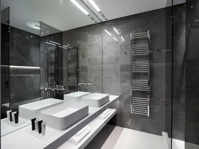 a bathroom with two sinks and a mirror at Athens Ikon in Athens