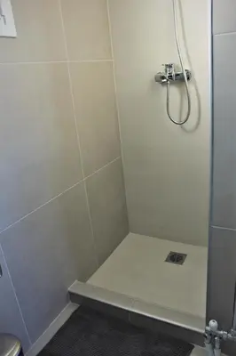 a bathroom with a shower with a glass door at Xenon Loft in Athens