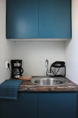 a kitchen counter with a sink and a coffee maker at Xenon Loft in Athens