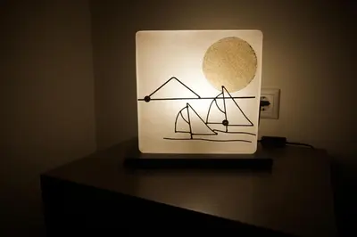a light on top of a table at Georgina's cozy apartment -Metropolitan Hospital- in Piraeus