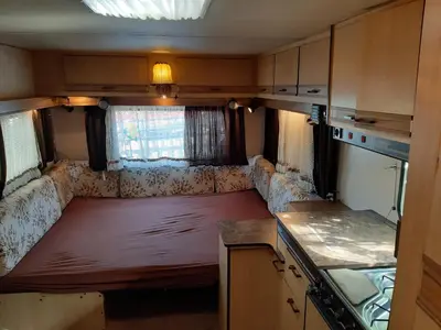 an empty couch in the back of an rv at Country Rooms near Athens - Airport in Vravrona