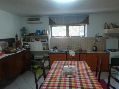 a kitchen with a table with a bowl on it at Country Rooms near Athens - Airport in Vravrona