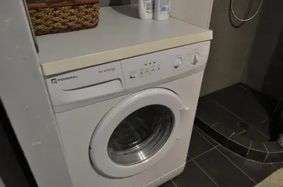 a white washer and dryer in a bathroom at Awesome Home 3' from Metro (M3) Station Agia Paraskevi in Athens