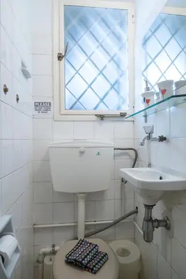 a bathroom with a toilet and a sink at ULTIMATE LOCATION CENTRAL ATHENS in Athens