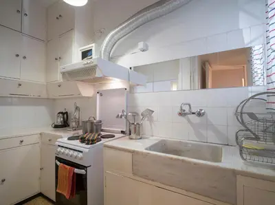 a kitchen with a sink and a stove at ULTIMATE LOCATION CENTRAL ATHENS in Athens