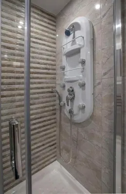 a bathroom with a shower with a toilet and a sink at Spacious & convenient place near Acropolis Museum by GHH in Athens