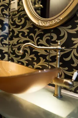 a bathroom with a sink and a mirror on a wall at MARGARITA'S SUITES in Athens