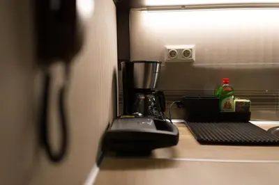 a blender sitting on top of a kitchen counter at MARGARITA'S SUITES in Athens