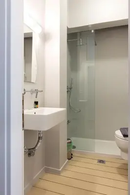 a bathroom with a sink and a shower at luxury kolonaki studio in Athens