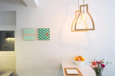 a kitchen with a table with a bowl of fruit at luxury kolonaki studio in Athens