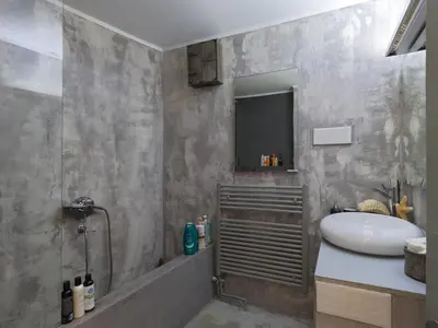 a bathroom with a sink and a toilet and a mirror at Live at the Acropolis shadow - under super scenic Anafiotika in Athens