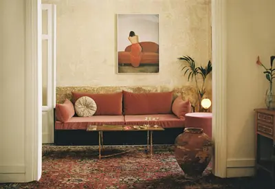 a living room with a couch and a table at Shila Athens in Athens