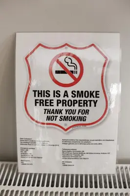 a sign on a shelf with a smoking sign on it at Alkamenous Apartment Petros VIPGreece in Athens