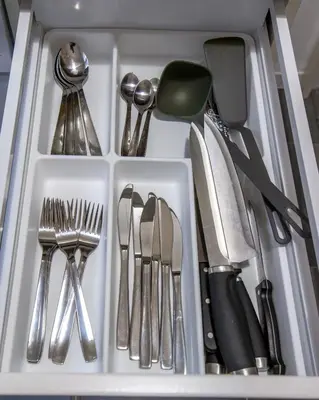a drawer filled with utensils in a kitchen at Alkamenous Apartment Petros VIPGreece in Athens