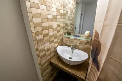 a bathroom with a sink and a mirror at Alkamenous Apartment Petros VIPGreece in Athens