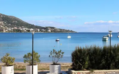 a view of a body of water with boats in it at Apartments MARE BLU by the sea. in Porto Rafti