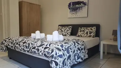a bedroom with a bed with two pillows on it at Palette Apartment Carmine - Athens Center, 6 BD, 3 BATH in Athens