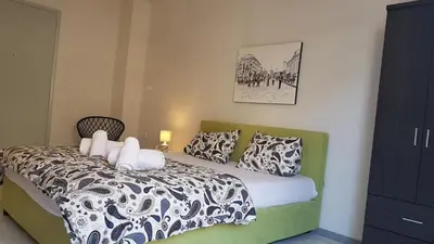 a bedroom with a bed with two pillows on it at Palette Apartment Carmine - Athens Center, 6 BD, 3 BATH in Athens