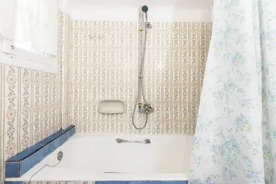 a bathroom with a tub and a shower curtain at Beautiful appartment under Akropolis! in Athens
