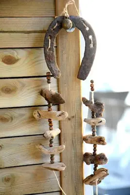 a wooden wall with rusty horseshoes on it at Athens Apartment in Athens