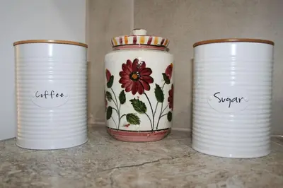 three white cups sitting on top of a counter at Athens Apartment in Athens