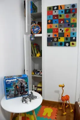 a childs room with a white table and a toy at Athens Apartment in Athens