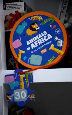 a book on animals of arapapa on a refrigerator at Athens Apartment in Athens