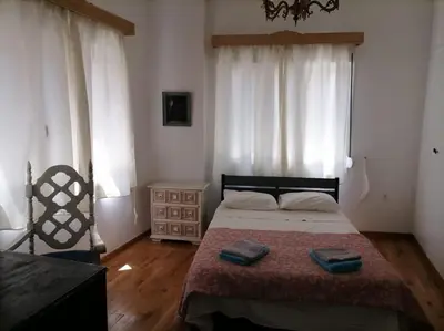 a bedroom with a bed with two towels on it at Athens Apartment in Athens