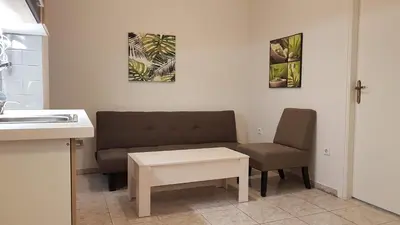 a living room with a couch and two chairs at Palette Apartment Bamboo - Athens Center, 6 BD, 3 BATH in Athens