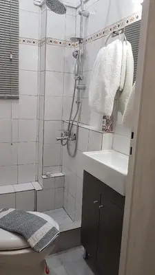 a bathroom with a shower and a sink and a toilet at Palette Apartment Bamboo - Athens Center, 6 BD, 3 BATH in Athens