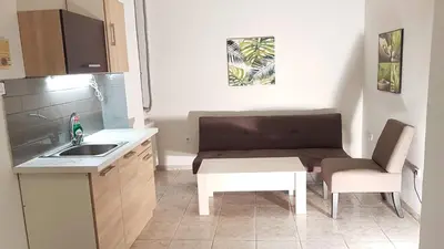 a small kitchen with a sink and a table at Palette Apartment Bamboo - Athens Center, 6 BD, 3 BATH in Athens
