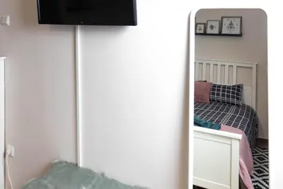 a bedroom with a bed and a mirror at Cozy Studio in the center of Athens in Athens