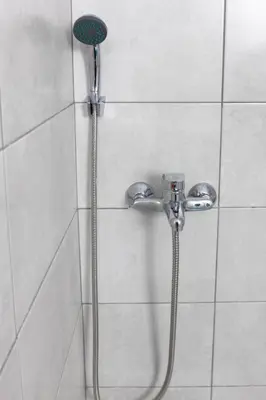 a shower with a shower head in a bathroom at Cozy Studio in the center of Athens in Athens