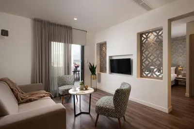a living room with a couch and a table at Urban Nest - Suites & Apartments in Athens