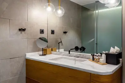 a bathroom with a sink and a mirror at Bob W Athens Eolou in Athens