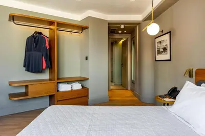 a bedroom with a bed and a closet at Bob W Athens Eolou in Athens