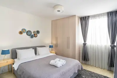 a bedroom with a bed with two towels on it at Morum Athens Urban Stay in Athens