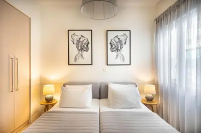 a bedroom with a bed with two pillows at Morum Athens Urban Stay in Athens