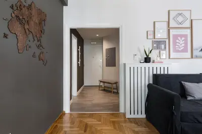 a living room with a couch and a hallway at Desirable 1BD Apartment in Kolonaki by UPSTREET in Athens