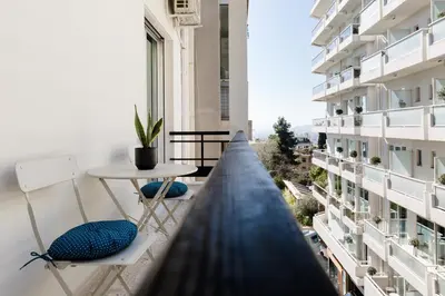 a view from the balcony of a building with a table and chairs at Desirable 1BD Apartment in Kolonaki by UPSTREET in Athens