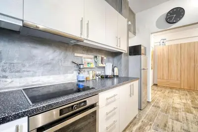 a kitchen with a sink and a stove at Athens Alex Apartment in Athens