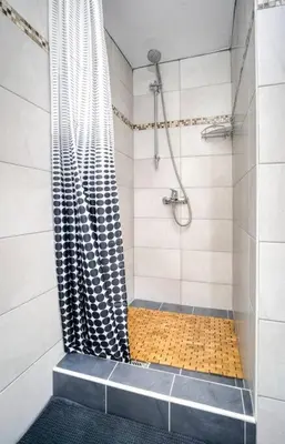 a bathroom with a shower with a shower curtain at Athens Alex Apartment in Athens