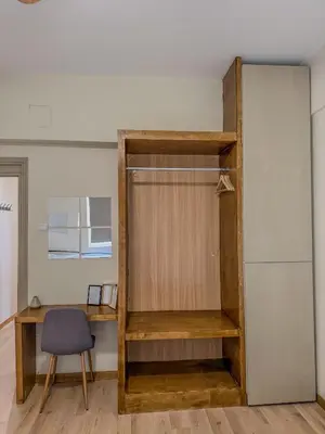 a room with a book shelf and a chair at AS Monastiraki Apartment 1B in Athens