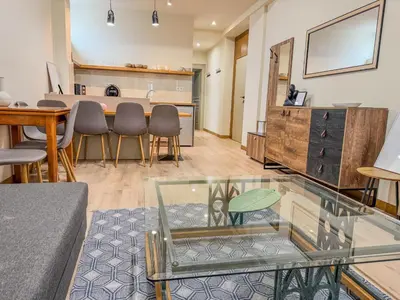 a living room with a glass table and chairs at AS Monastiraki Apartment 1B in Athens