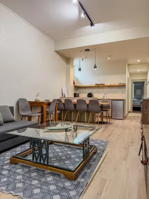 a living room with a couch and a table at AS Monastiraki Apartment 1B in Athens