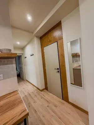 a room with a door and a wooden floor at AS Monastiraki Apartment 1B in Athens