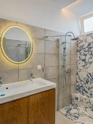 a bathroom with a sink and a shower at AS Monastiraki Apartment 1B in Athens