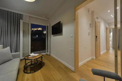 a living room with a couch and a table at A.P. Acropolis View Apartments in Athens